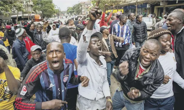 ?? PICTURE: AFP/ GETTY IMAGES ?? 0 In Nairobi, jubilant ruling party supporters celebrate the decision of the Supreme Court not to delay the re- run of the presidenti­al elections