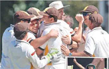  ?? Pictures: GLENN FERGUSON ?? FINALS TIME: Drysdale players celebrate their brilliant bowling effort against Queensclif­f.