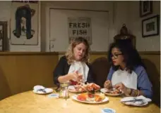  ?? ANDREW LAHODYNSKY­J FOR THE TORONTO STAR ?? Bronwen Clark of Rodney’s Oyster House, left, shows reporter Aparita Bhandari the proper way to eat a lobster — with your hands.