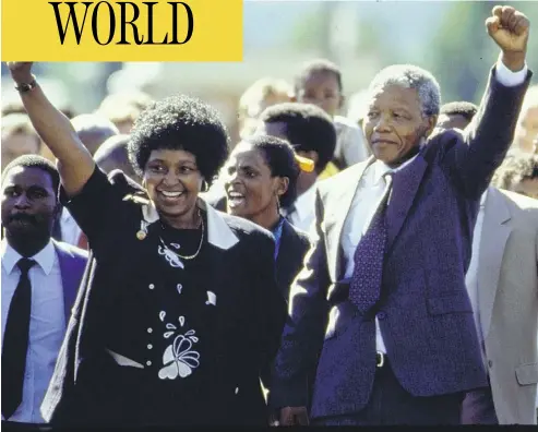  ?? ALLAN TANNENBAUM/THE LIFE IMAGES COLLECTION/GETTY IMAGES ?? Nelson Mandela and his wife Winnie raise their fists upon his release from prison in South Africa in 1990. Winnie Mandela, whose polarizing behaviour drove Nelson to later divorce her, died on Monday in Johannesbu­rg.