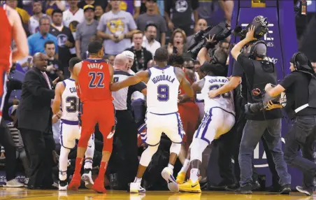  ?? Michael Macor / The Chronicle 2017 ?? Golden State’s Draymond Green and Washington’s Bradley Beal were ejected after this 2017 incident at Oracle Arena. Many of the Warriors fans who booed Kelly Oubre Jr. that night might soon thank him for filling in well for an injured star.