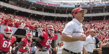  ?? DAVID BARNES / DAVID.BARNES@AJC.COM ?? Coach Kirby Smart and his staff plan to use next month’s practices to answer many player personnel questions. A handful of starting jobs appear to be open heading into the season.