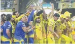  ?? AP ?? Chennai Super Kings players celebrate with the trophy.