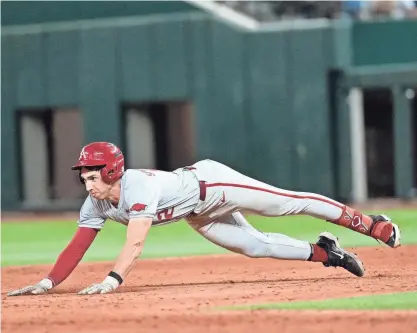  ?? JIM COWSERT/USA TODAY SPORTS ?? Arkansas vs. Oklahoma State at Globe Life Field in Arlington on Saturday.