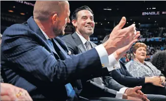  ?? PHIPPS/THE OKLAHOMAN] ?? Nick Collison, right, talks with Thunder owner Clay Bennett during Wednesday night's game against the Toronto Raptors at Chesapeake Energy Arena. Collison had his jersey No. 4 retired before the game.