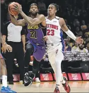  ?? Wally Skalij Los Angeles Times ?? PATRICK BEVERLEY of the Lakers drives baseline against Jaden Ivey of the Pistons in the first quarter.