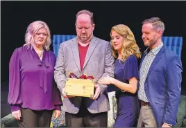 ?? (Courtesy Photo/APT) ?? Corky (Stephanie Whitcomb, left) and Norm (Scott Kammerzell, second from left) aren’t sure what to make of the unusual gift of eggplant that’s appeared along with two unusual guests, Laura (Amy Eversole) and Gerald (Joseph Farmer) in the Arkansas Public Theatre production of Steve Martin’s “Meteor Shower.” The show was ready to open in March, when the coronaviru­s forced its postponeme­nt — until 2021.