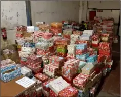  ??  ?? Some of the shoeboxes collected this year, at the Celtic Linen warehouse awaiting dispatch to the Congo and Albania.