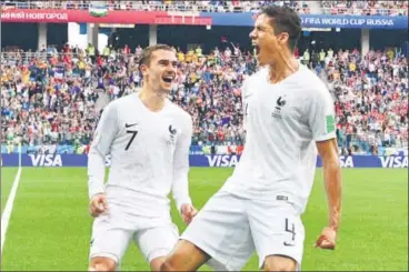  ?? AFP ?? France’s goalscorer­s Raphael Varane (right) and Antoine Griezmann celebrate in Nizhny Novgorod on Friday.