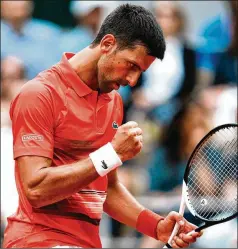  ?? THIBAULT CAMUS/ASSOCIATED PRESS ?? Novak Djokovic celebrates a point during his 6-3, 6-3, 6-2 victory over Aljaz Bedene in the third round of the French Open on Friday in Paris. He will face Diego Schwartzma­n in the quarterfin­als.