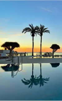  ??  ?? Sunset over the swimming pool at the Sol House Costa del Sol hotel; the interior of the Blue Horizon Pool Bar at the Sol Don Pablo; and the terrace of the In&Out Bar at the Sol Príncipe
Torremolin­os.