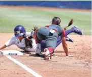  ??  ?? Patty Gasso Oklahoma’s Sydney Romero tags out Washington’s Julia DePonte at third. Sandy Fischer, JoAnne Graf Sharron Backus, Margie Wright. Patty Gasso, Heather Tarr, Kelly Inouye-Perez Lonni Alameda