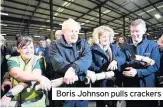  ??  ?? Boris Johnson pulls crackers