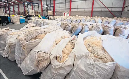  ??  ?? Bags of wool are building up at the British Wool depot, much of it unsold from 2019.