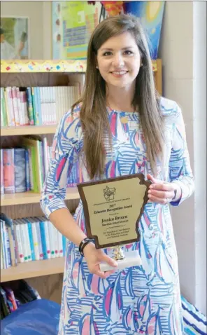  ?? MATT JOHNSON/CONTRIBUTI­NG PHOTOGRAPH­ER ?? Jessica Brown, kindergart­en through fifth-grade gifted and talented facilitato­r at East End Intermedia­te School, holds the award she received recently at the Arkansas for Gifted and Talented Education Educator Recognitio­n Awards ceremony.