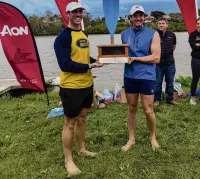  ?? PHOTOS: SUPPLIED ?? Home again . . . Otago University rowers Kobe Miller (left) and Oliver Fahey hold the ‘‘Ashes” at the New Zealand universiti­es rowing regatta in Whanganui at the weekend.