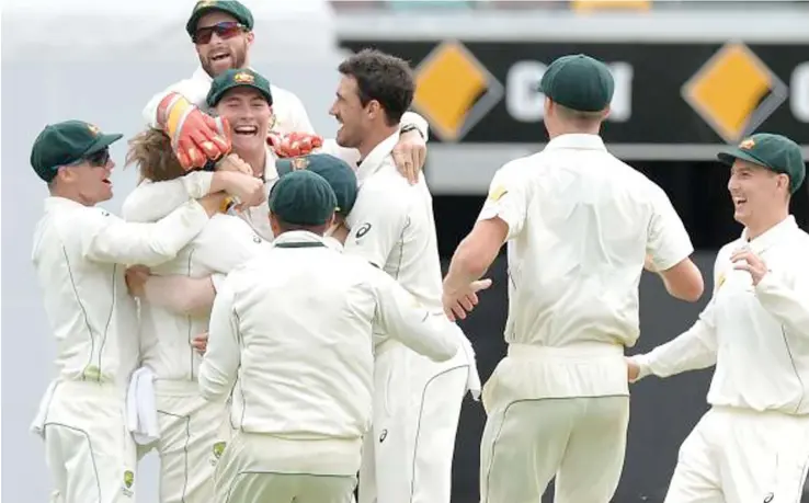  ?? Australia celebrate their win over Pakistan in the first Test at the Gabba. ??