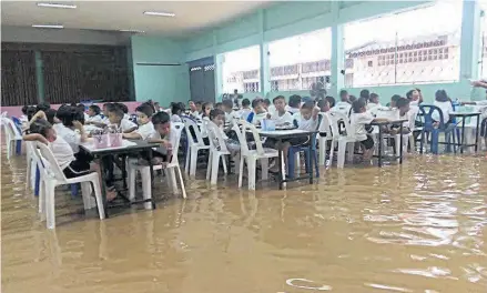  ?? PHOTO BY @K5_RESCUE ON TWITTER ?? A schools in Phuket inundated during lashfloods triggered by torrential downpours. Urban areas across the world are vulnerable to climate changeindu­ced natural disasters.