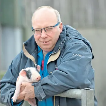  ??  ?? HELPING HAND: Aberdeensh­ire pig farmer Kevin Gilbert features in the new film.