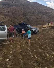  ??  ?? WELL DONE, MEN. There are few things as satisfying as meat on the coals and a cold beverage in hand when you’ve passed a true 4x4 test without incident. At some places in Lesotho you need to have nerves of steel.