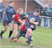  ??  ?? ●● Paul Millea carries the ball forward for the Blues with Elliot Millar-Mills in support