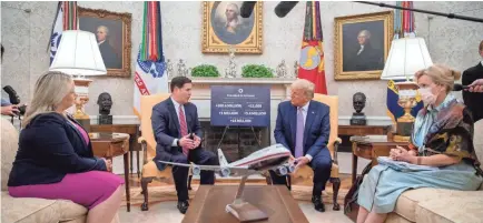  ?? ANDREW HARNIK/AP ?? In friendlier times, President Donald Trump praised Arizona Gov. Doug Ducey for doing “an incredible job” to contain the coronaviru­s. Their relationsh­ip has gone sour since Trump lost the election.