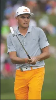  ?? The Associated Press ?? ON THE DOORSTEP: Coming up short again in another major tournament, this one won by Justin Thomas, Rickie Fowler watches his putt on the 16th hole during the final round of the PGA Championsh­ip Sunday at Quail Hollow Club in Charlotte, N.C.