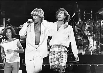  ??  ?? George Michael (left) and Andrew Ridgeley of Wham! perform in Beijing on Apr 7, 1985.