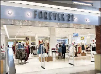  ??  ?? Customers arrive to shop at Forever 21 on Sept 30, 2019, at Walden Galleria in Cheektowag­a, N.Y. Forever 21 has filed for Chapter 11 bankruptcy protection. The privately held company based in Los Angeles said Sunday,
Sept 20, that it will close up to 178 stores in the US. (AP)