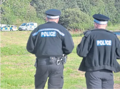  ?? Picture: Paul Smith. ?? Police at the scene on the banks of the River North Esk at Marykirk.