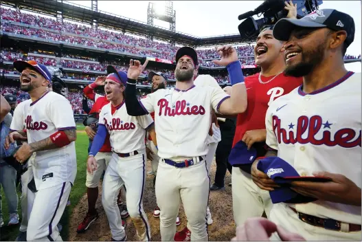  ?? MATT ROURKE — THE ASSOCIATED PRESS ?? The Phillies celebrate a win over the Atlanta Braves after Game 4to advance to the NLCS where they will play the San Diego Padres.