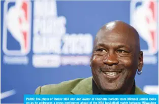  ?? —AFP ?? PARIS: File photo of former NBA star and owner of Charlotte Hornets team Michael Jordan looks on as he addresses a press conference ahead of the NBA basketball match between Milwaukee Bucks and Charlotte Hornets at The AccorHotel­s Arena in Paris on January 24, 2020