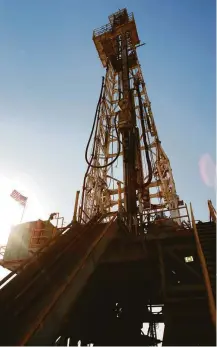  ?? Brett Coomer / Houston Chronicle file ?? Anadarko is operating seven rigs as it scales back, and Shell is operating six as it gets familiar with the Permian.