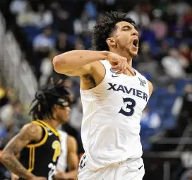  ?? CHRIS CARLSON / AP ?? Xavier’s Colby Jones celebrates after scoring Sunday against Pitt in an NCAA tournament game in Greensboro, N.C. Five of the 10 best 3-point shooting teams in the country made the tourney but just two are left: Xavier and Michigan State.