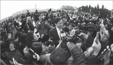  ??  ?? Lei Jun, a deputy to the 13th National People’s Congress (NPC) and chairman of Xiaomi Technology, talks to reporters before the opening session of the NPC in Beijing on Monday. Lei said that the Government Work Report’s proposed tax cut of 800 billion...