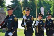  ?? MARIAN DENNIS – DIGITAL FIRST MEDIA ?? The Berks County Sheriff’s Department Honor Guard began Thursday’s Flag Day ceremony outside Keystone Villa in Douglassvi­lle with a procession toward the flag.