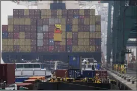  ?? VIRGINIA MAYO — ASSOCIATED PRESS FILE ?? A container is loaded onto a ship in the Port of Antwerp, Belgium, on Aug. 17.