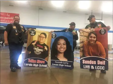  ?? KEVIN MARTIN — THE MORNING JOURNAL ?? Members of the Lorain branch of the Latin American Motorcycle Associatio­n assemble banners May 30at Sacred Heart Chapel, 4301 Pearl Ave. in Lorain, honoring local graduates.