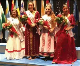  ?? RICHARD PAYERCHIN — THE MORNING JOURNAL ?? Members of the Lorain Internatio­nal Festival court stand for a group photograph backstage at the Lorain High School Performing Arts Center on June 21. Pictured from left are Puerto Rican Princess Ivelysse Gracia, third runner up; Lebanese Princess Emma Marie Kelley, first runner up; Hungarian Princess Emily Hetrick, who was crowned queen; and Filipino Princess Katherine Jusiniani, second runner up.