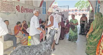  ?? ?? Residents queue to see Chintu Patel and his team.