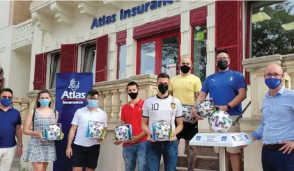  ??  ?? All smiles! The first winners of the ‘Atlas Matchday Moments’, in collaborat­ion with TVMSport, pose in front of Atlas Insurance Head Office as they received their UEFA Euro 2020TM Uniforia official match ball.
