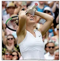  ?? AP/KIRSTY WIGGLESWOR­TH ?? Simona Halep reacts after defeating Serena Williams 6-2, 6-2 in the Wimbledon women’s championsh­ip Saturday at the All England Club in London. It was Halep’s second major championsh­ip.