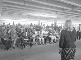  ?? Houston Chronicle ?? Residents fighting eviction from public housing at 2100 Memorial Drive confront Houston Housing Authority officials Thursday. Residents worry the eviction attempt is at the behest of developers.