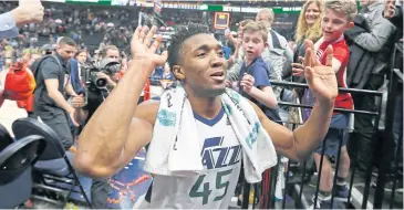  ?? AP ?? The Jazz’s Donovan Mitchell celebrates as he runs off the court after their game against the Spurs.