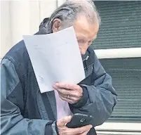  ?? PAUL FRANGIPANE/BROOKLYN EAGLE ?? Dr. Martin Tesher, covering his face last year outside U.S. federal court in Brooklyn, N.Y., has faced a string of serious drug allegation­s and discipline over the years that escalated to criminal charges last year. The criminal charges against him...