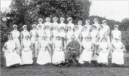  ??  ?? Founders: The St John Epsom Division circa 1914. Evelyn Firth is to the left of the man at the front.