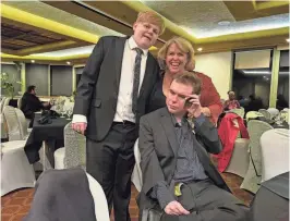  ?? ?? Lori Enroth and sons Andrew and Mathew attend the gala.