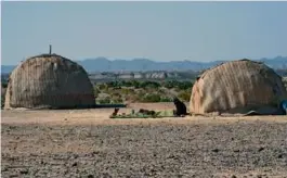  ?? BANARAS KHAN/AFP VIA GETTY IMAGES ?? A woman sat near her hut in Pakistan’s Baluchista­n province, where Iran launched an airstrike, on Thursday.