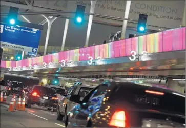  ?? Robyn Beck
AFP/Getty Images ?? ABOUT HALF A MILLION people are expected to watch about 6,500 athletes participat­e in the Special Olympics World Games. Above, an LED lightband at LAX programmed with the event’s colors.