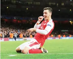  ??  ?? Arsenal inspiratio­nal player, Mesut Ozil celebrates after scoring a goal